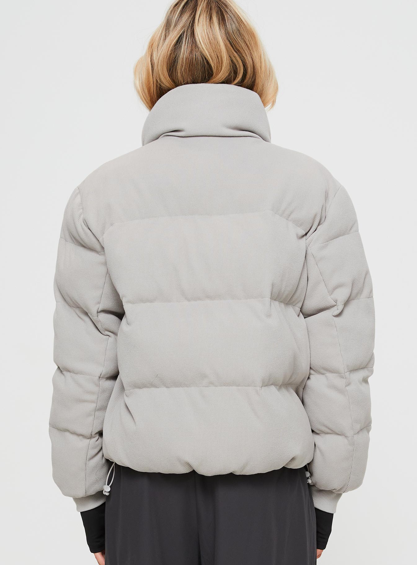 Ribbed puffer jacket High neckline, twin hip pockets, zip fastening down front, drawstring waist, elasticated cuffs
