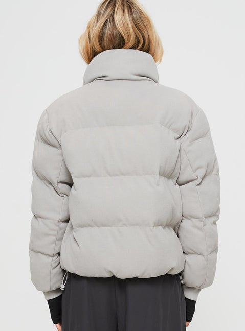 Ribbed puffer jacket High neckline, twin hip pockets, zip fastening down front, drawstring waist, elasticated cuffs
