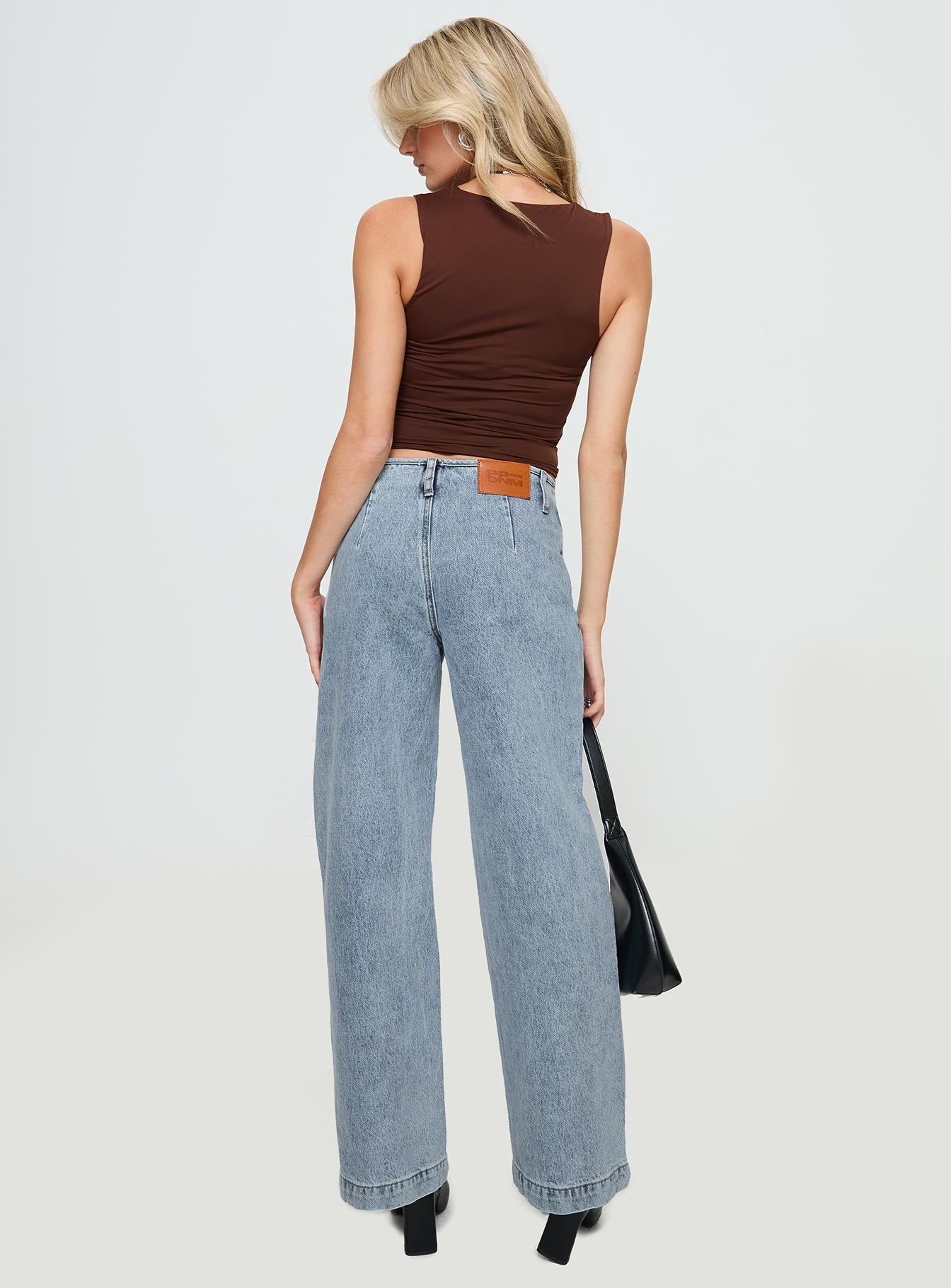 back view of model wearing Princess Polly Thaddeus Jeans Mid Wash Low Rise Jeans 