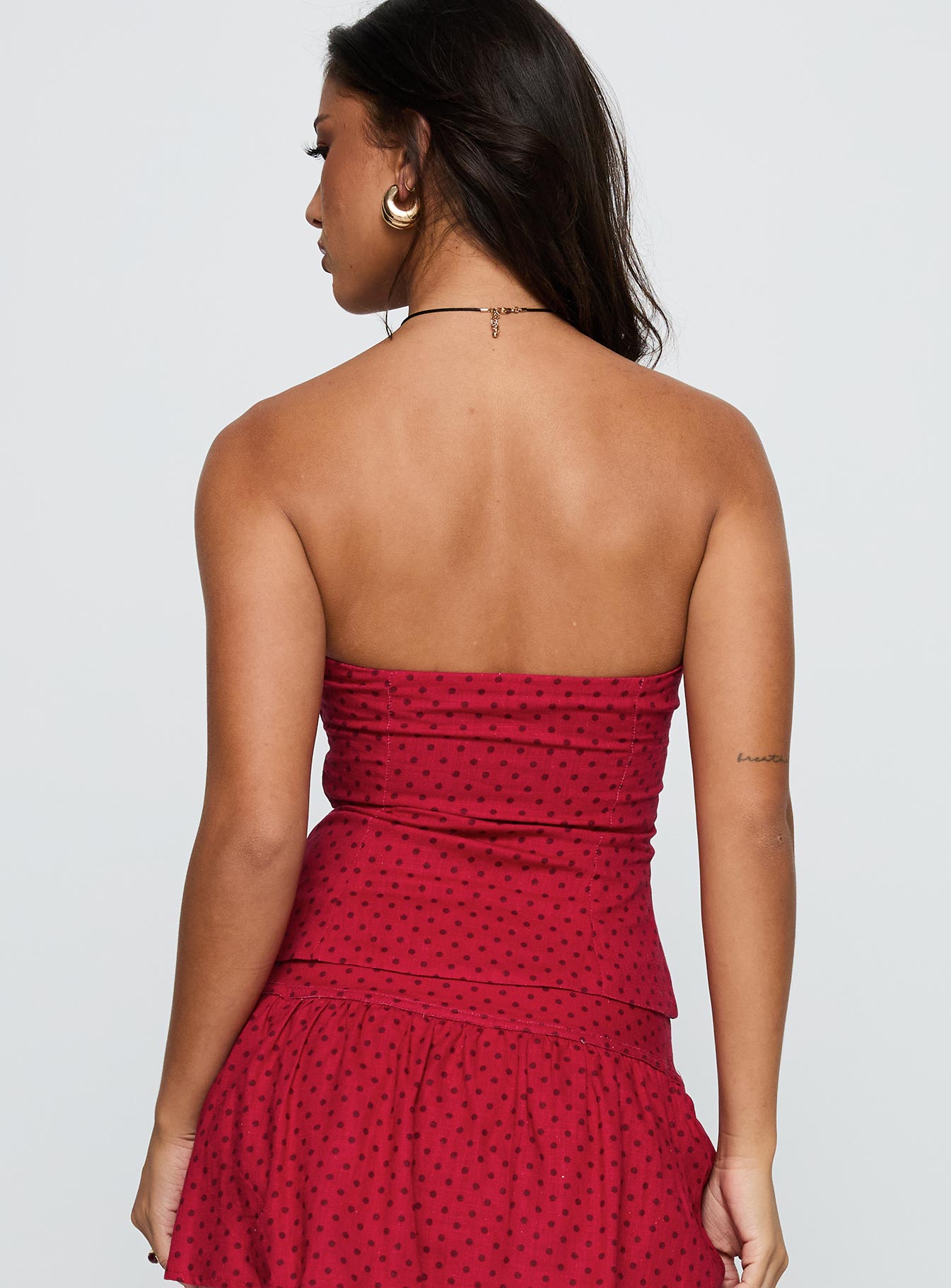 back view of model wearing Princess Polly Kandee Twist Linen Blend Top Red Polka Sleeveless Sweetheart 