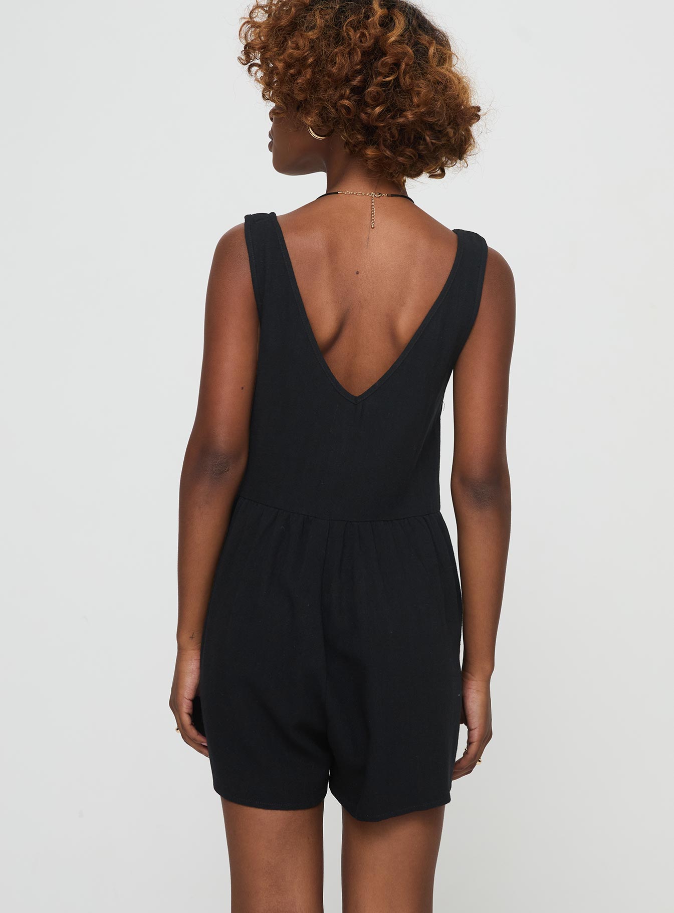 Romper Fixed shoulder straps, v-neckline, tie fastening at bust, invisible zip fastening at side, twin hip pockets Non-stretch material, unlined 