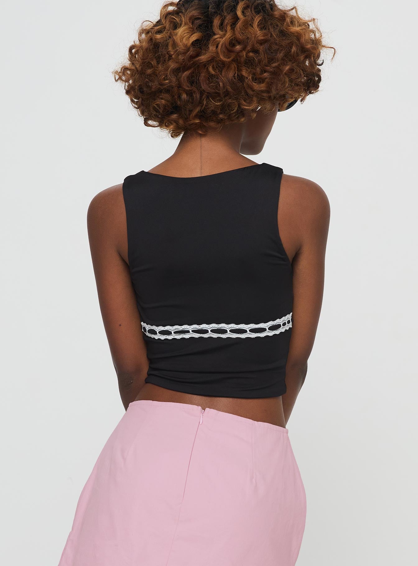 back view of model wearing Princess Polly Mekhi Top Black Sleeveless V-Neck 