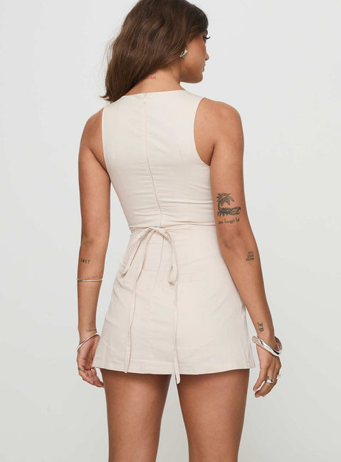 Romper High neckline, invisible zip fastening at back, waist tie fastening, built-in shorts Non-stretch material, fully lined  Princess Polly Lower Impact  