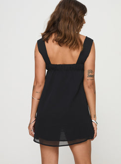 back view of model wearing Princess Polly Mooney Mini Dress Black Square Neck 