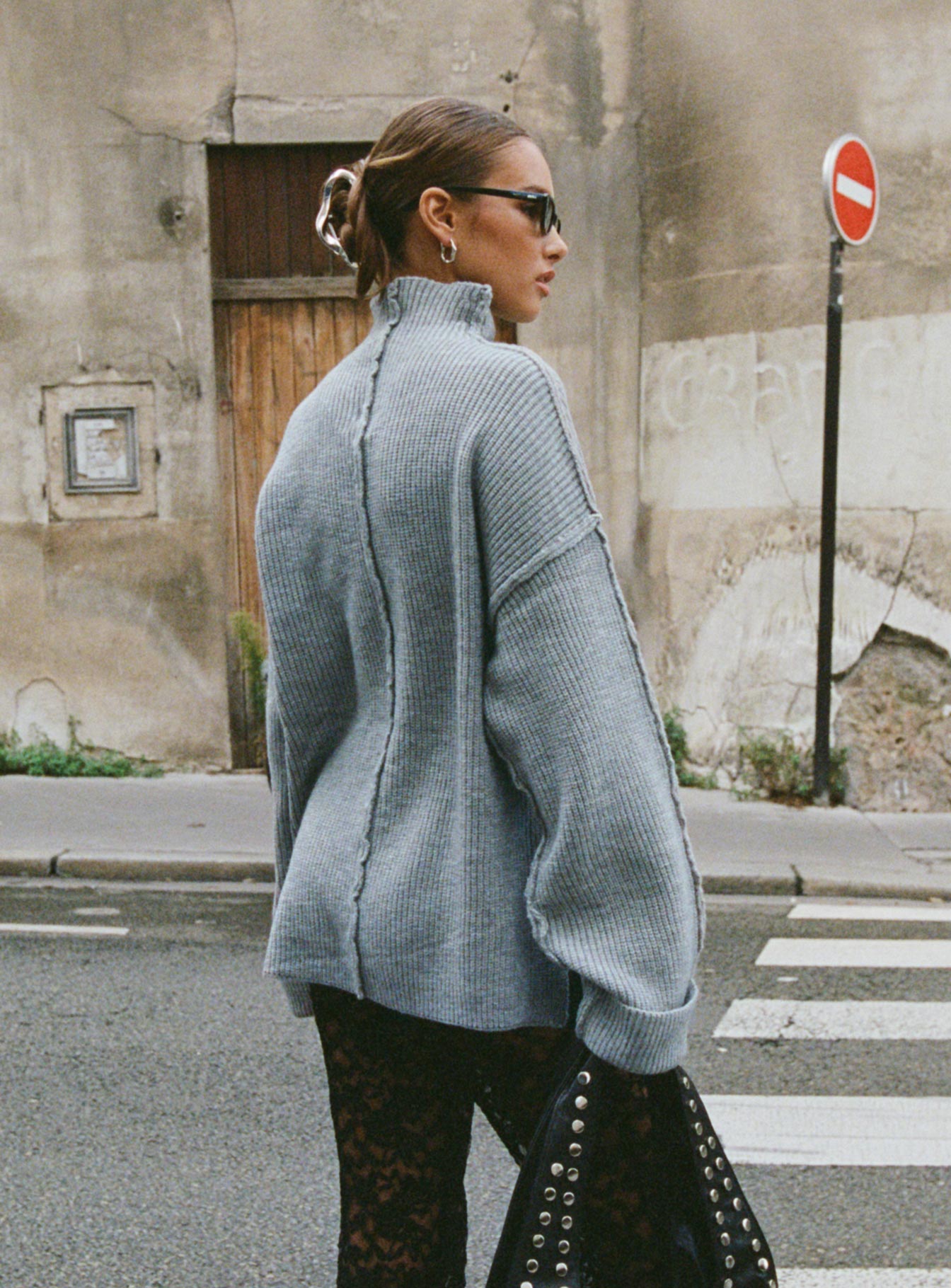 back view of model wearing Princess Polly Lachlynn Oversized Knit Sweater Charcoal Marle 