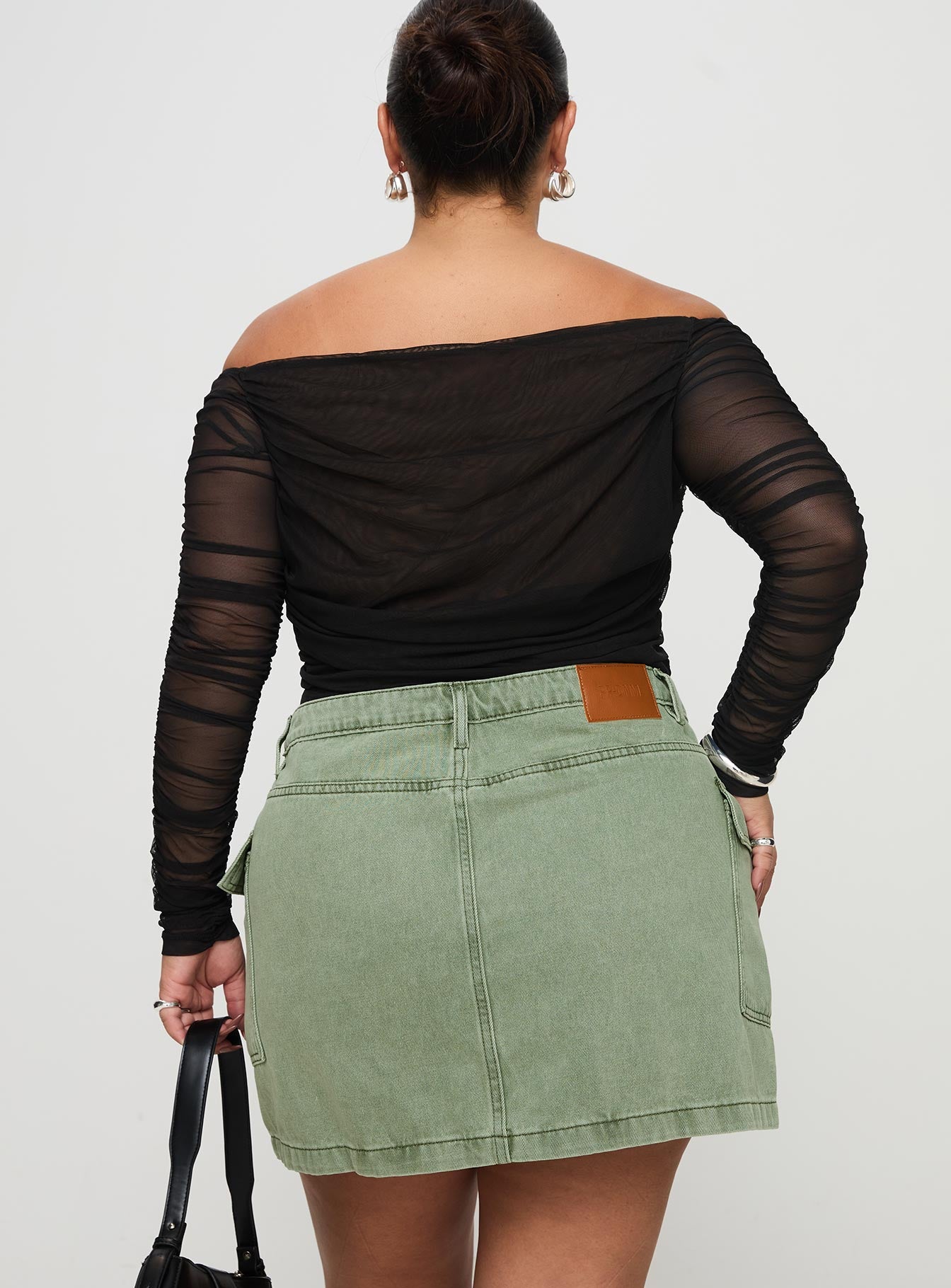 back view of model wearing Princess Polly Zakai Cargo Denim Mini Skirt Green Curve Mini Skirts 