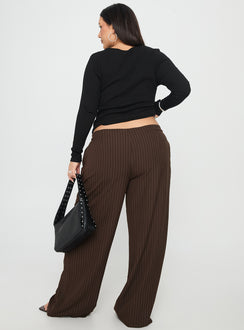 back view of model wearing Princess Polly Khane Low Rise Wide Leg Pant Brown Pinstripe Curve Low Rise Pants 