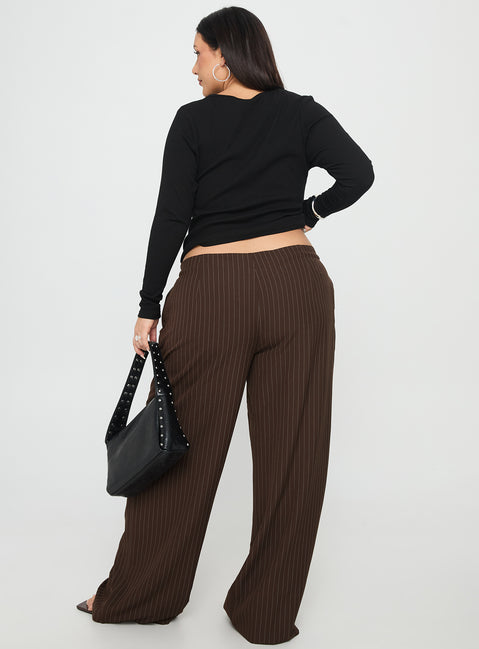 back view of model wearing Princess Polly Khane Low Rise Wide Leg Pant Brown Pinstripe Curve Low Rise Pants 