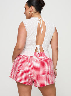 back view of model wearing Princess Polly Beach House Shorts Red / White Gingham Curve 
