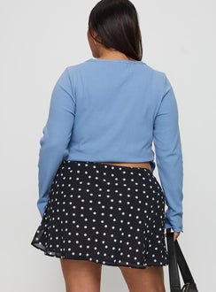 back view of model wearing Princess Polly Dapple Bias Mini Skirt Black Polka Dot Curve Mini Skirts 
