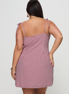 back view of model wearing Princess Polly Burkes Mini Dress Red Check Curve Square Neck 