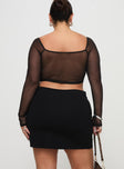 back view of model wearing Princess Polly Karley Low Waist Mini Skirt Black Curve Mini Skirts 