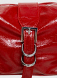 Shoulder bag Faux leather, adjustable strap, zip and button closure, silver-toned hardware, flat base, internal pockets