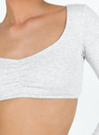 Long sleeve crop top V neckline Pinched detail at bust Good stretch Lined body