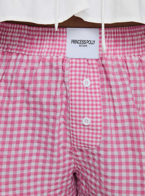 back view of model wearing Princess Polly Back To It Boxer Shorts Pink Gingham High Waisted Shorts 