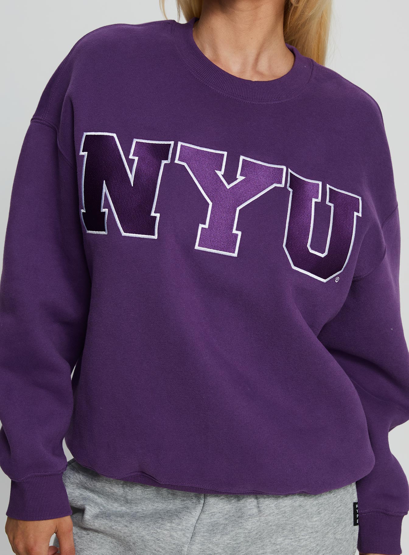 back view of model wearing Princess Polly NYU Offside Crewneck Sweatshirt Purple 