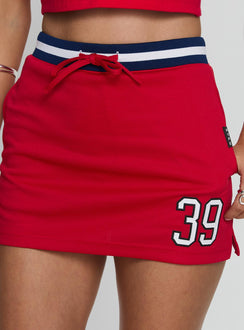 back view of model wearing Princess Polly Boston University Basketball Skirt Red Mini Skirts 