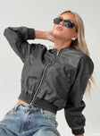 Faux Leather Jacket  Drop shoulder, ribbed collar, cuff & hem, twin hip pockets with clasp fastening  Zip fastening at front 