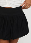   side view of model wearing Princess Polly Mersale Bubble Hem Mini Skirt Black Mini Skirts 