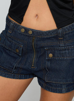 back view of model wearing Princess Polly Catch Me Now Denim Shorts Dark Blue Wash Low Rise Shorts 