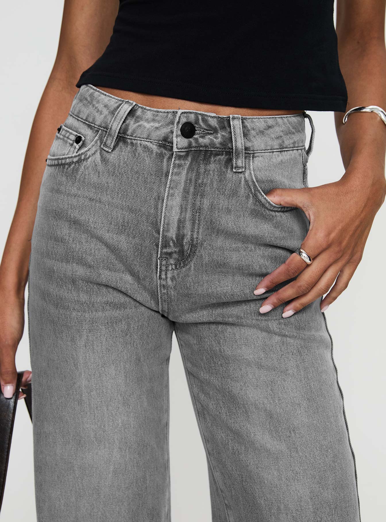 back view of model wearing Princess Polly Henesey Raw Hem Jeans Washed Grey High Waisted 