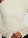 back view of model wearing Princess Polly Beller Long Sleeve Lace Top Cream Full Sleeves Asymmetric Neckline 