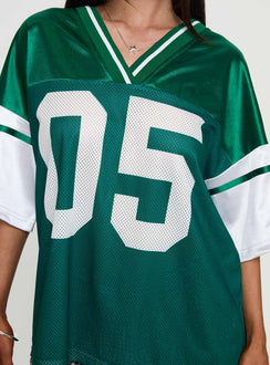 back view of model wearing Princess Polly Kronwall Sports Jersey Top Green / White Three Fourth Sleeves V-Neck 