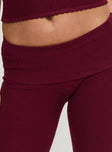 back view of model wearing Princess Polly Closed Eyes Flared Pants Maroon Low Rise Pants 