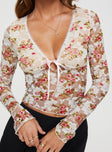 Long sleeve floral lace top V-neckline, ribbon detail, flared cuff Good stretch, lined bust
