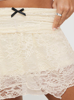 Front view of model wearing  front Feel The Heat Lace Mini Skirt Cream Princess Polly  Maxi 