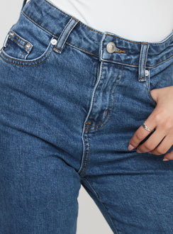 back view of model wearing Princess Polly Lucille High Rise Flare Leg Jeans Mid Wash High Waisted 