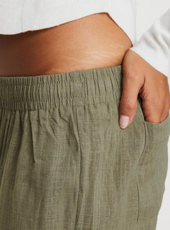 Front view of model wearing  front Princess Polly Low Rise Pants  Louis Linen Blend Pants Olive