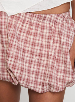 back view of model wearing Princess Polly Cydnee Bubble Hem Mini Skort Red Multi Low Rise Shorts 