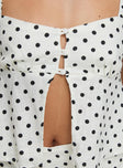 back view of model wearing Princess Polly Passionfruit Linen Blend Top Cream/Black Polka Dot Short Sleeves Square Neck 