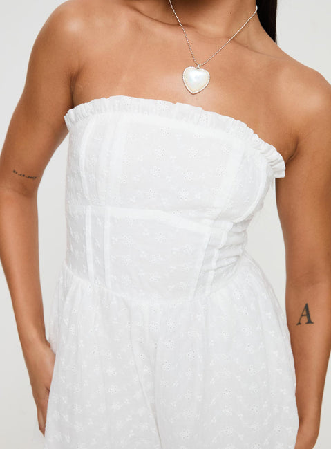 Strapless romper Embroidered flower print, inner silicone strip at bust, shirred elasticated band at back, frill detail at bust