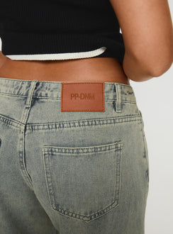 back view of model wearing Princess Polly Jaycee Low Rise Wide Leg Jeans Antique Wash Low Rise Jeans 