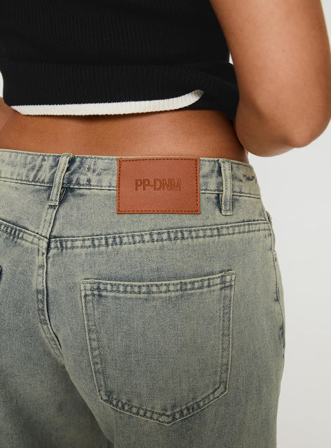 back view of model wearing Princess Polly Jaycee Low Rise Wide Leg Jeans Antique Wash Low Rise Jeans 