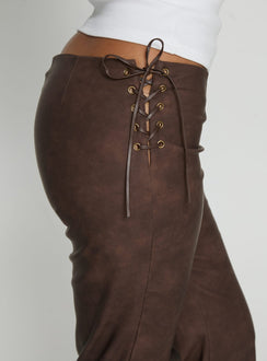 side view of model wearing Princess Polly Trickrider Tie Side Faux Leather Pants Chocolate Mid Rise Pants 