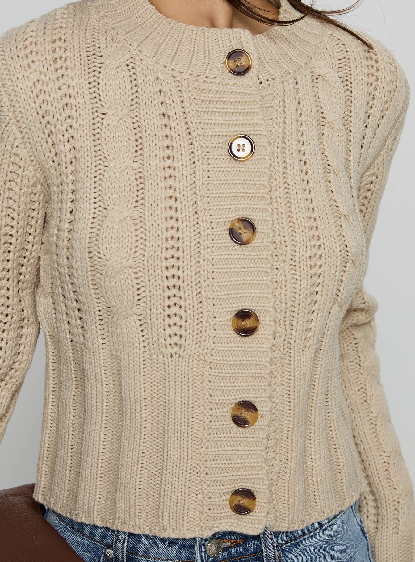 back view of model wearing Princess Polly Donielle Cable Knit Cardigan Beige cropped 