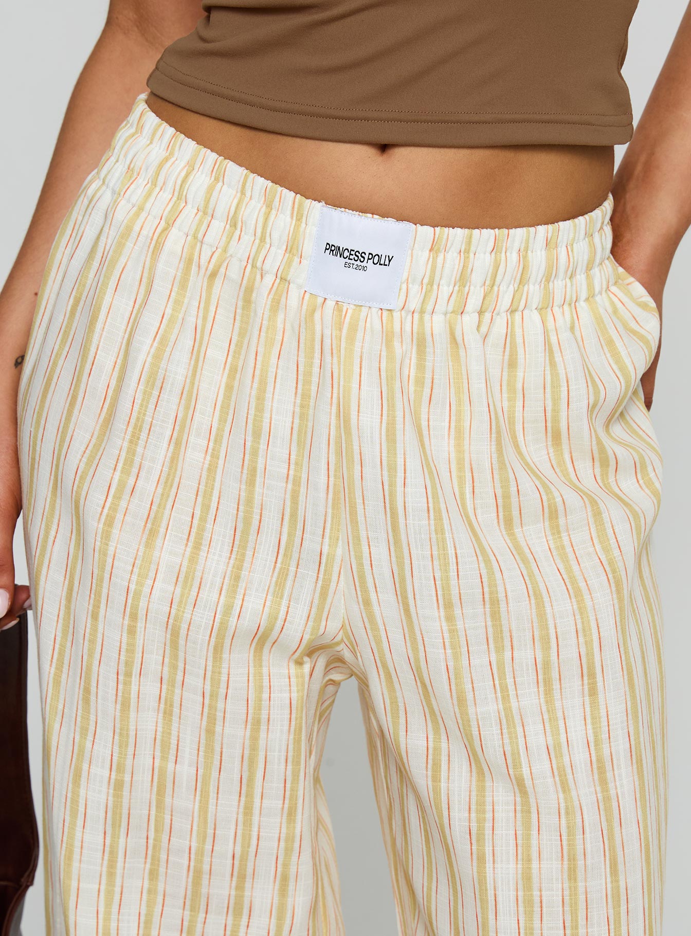 back view of model wearing Princess Polly Beach House Pants Yellow Stripe High Waisted Pants 