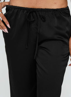 back view of model wearing Princess Polly Vanille Tie Waist Satin Pants Black Low Rise Pants 