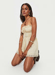 Strapless playsuit  Lace details, ruffle neckline, adjustable tie at neckline, shirred back, twin hip pockets 