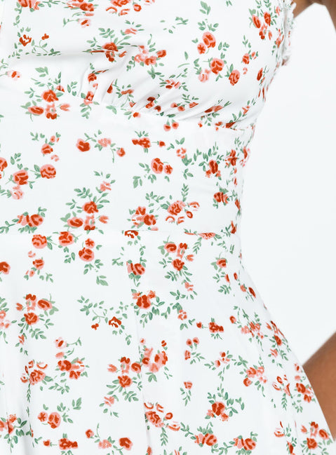 Romper Floral print Ruffle detailing Open back with tie Invisible zip at back Elasticated backband Fixed straps Fully lined