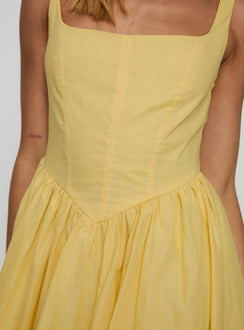 front view of model wearing Princess Polly Alcott Bubble Hem Mini Dress Lemon Square Neck 