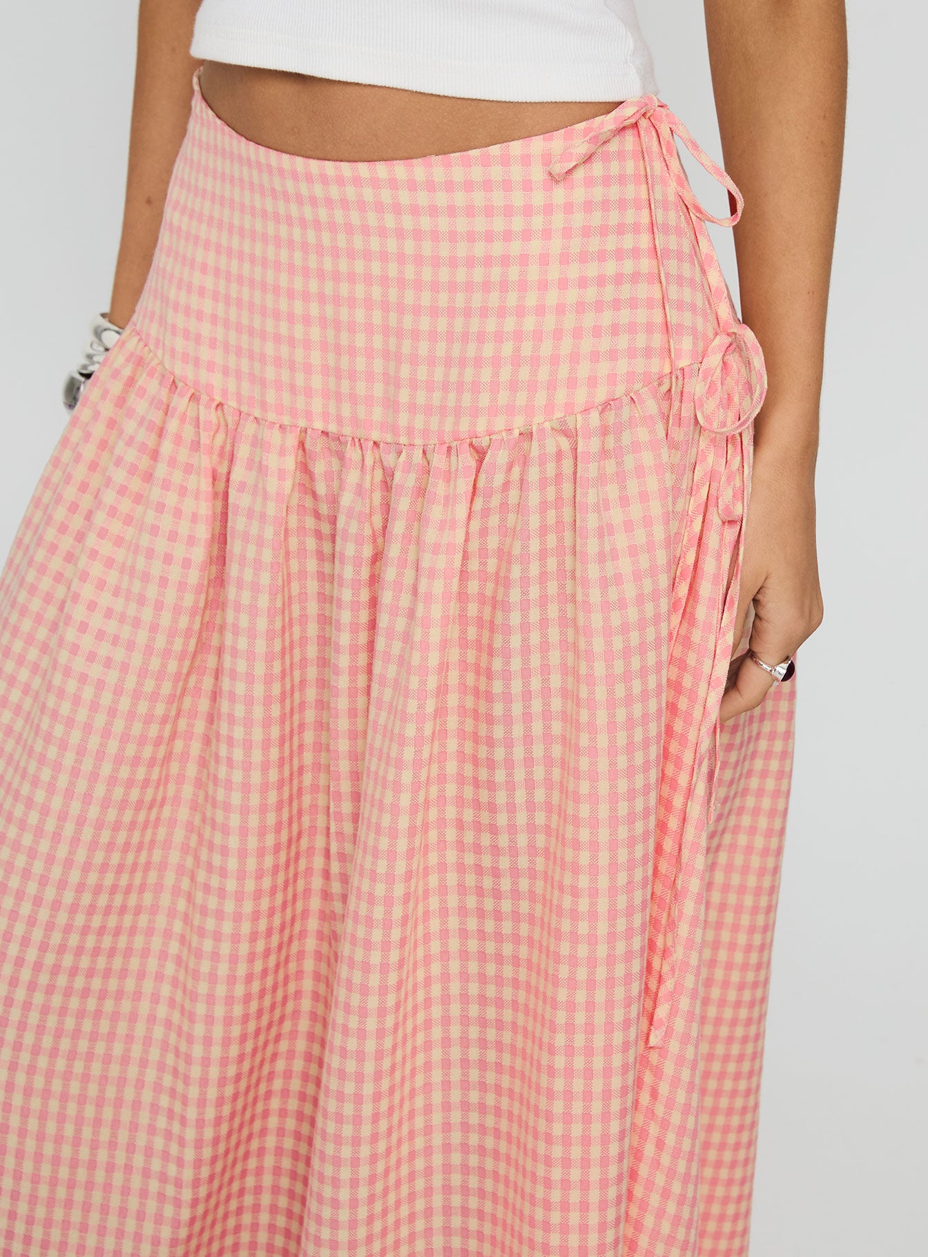 back view of model wearing Princess Polly Analeah Tie Side Midi Skirt Orange Check Maxi 