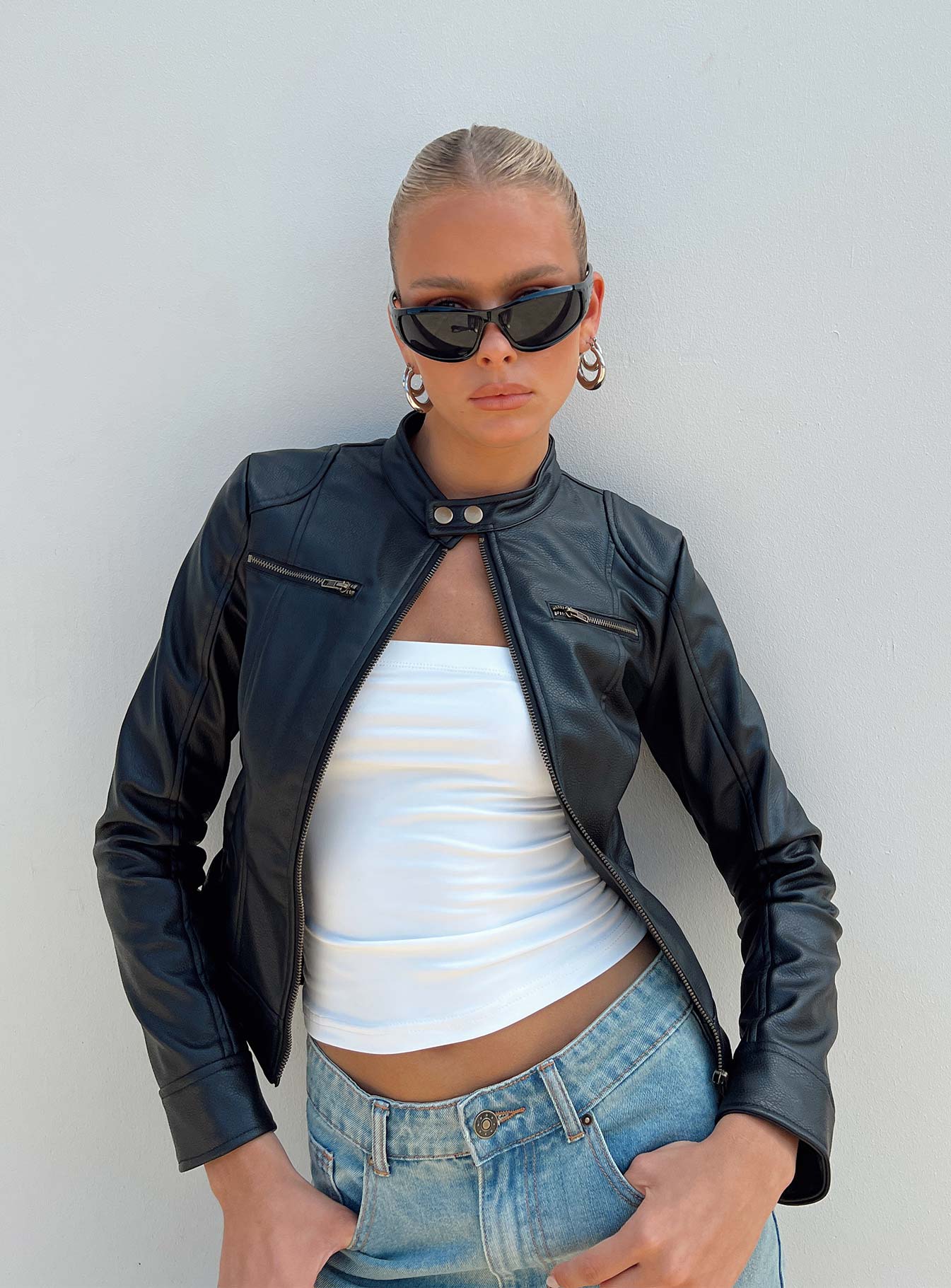 Leather jacket Faux leather material Gold-toned hardware High neck Zip fastening at front