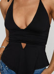 back view of model wearing Princess Polly Averee Halter Top Black Sleeveless Plunger 