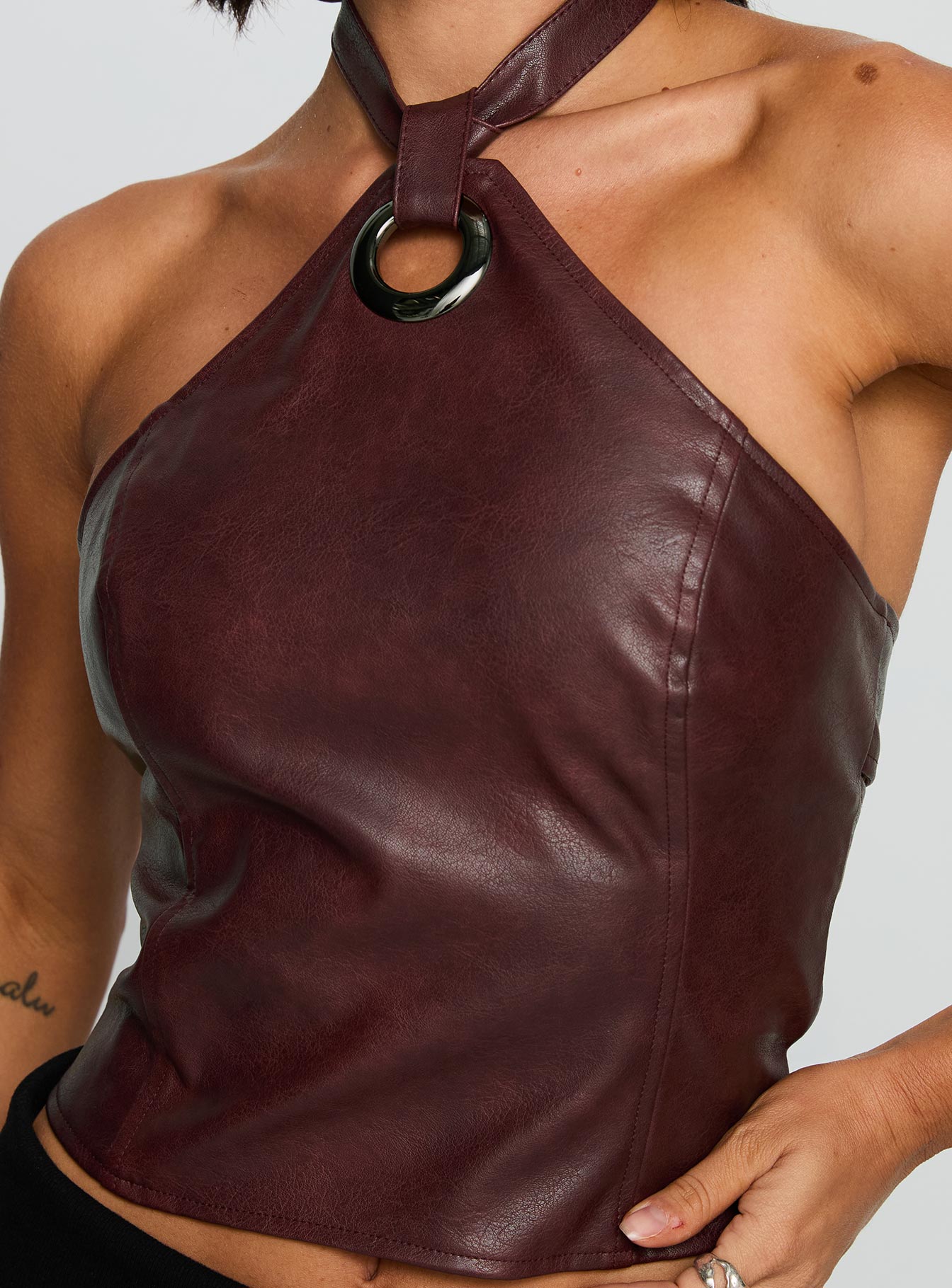 back view of model wearing Princess Polly Treat You Better Ring Detail Faux Leather Top Burgundy Sleeveless Asymmetric Neckline 