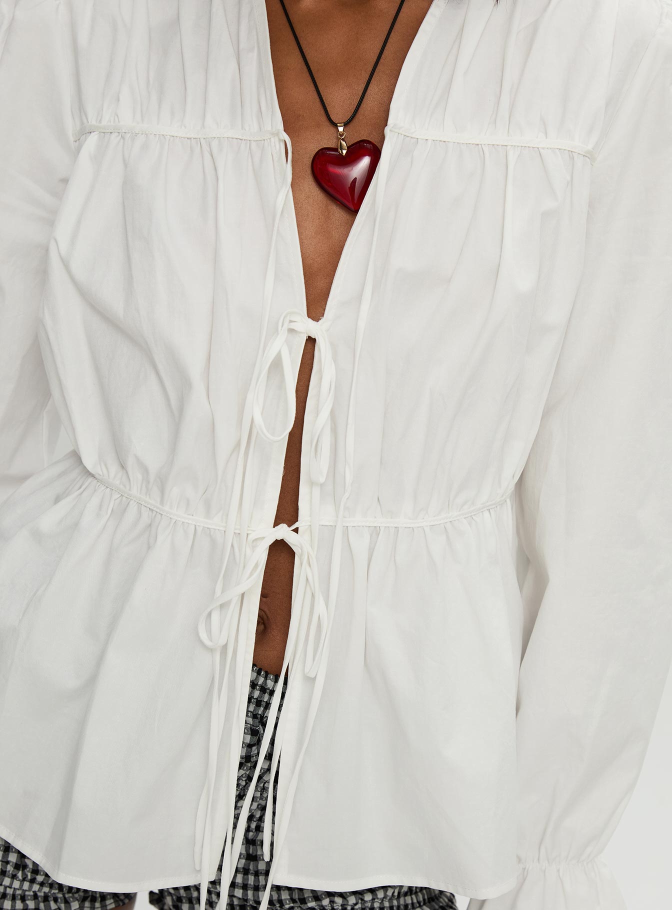 back view of model wearing Princess Polly Scarlotte Bow Tie Top White Full Sleeves V-Neck 