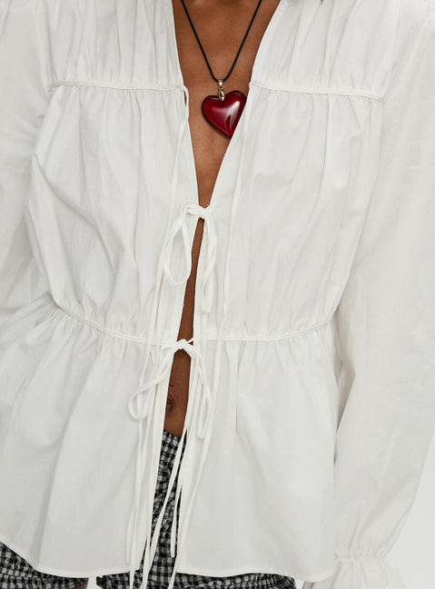 back view of model wearing Princess Polly Scarlotte Bow Tie Top White Full Sleeves V-Neck 